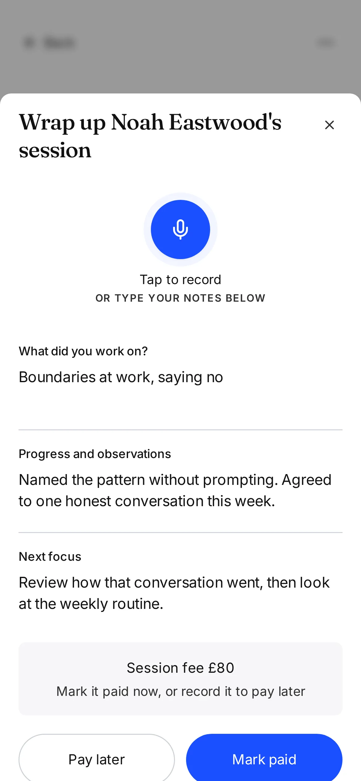 Completing a life coaching session and writing a note on a phone